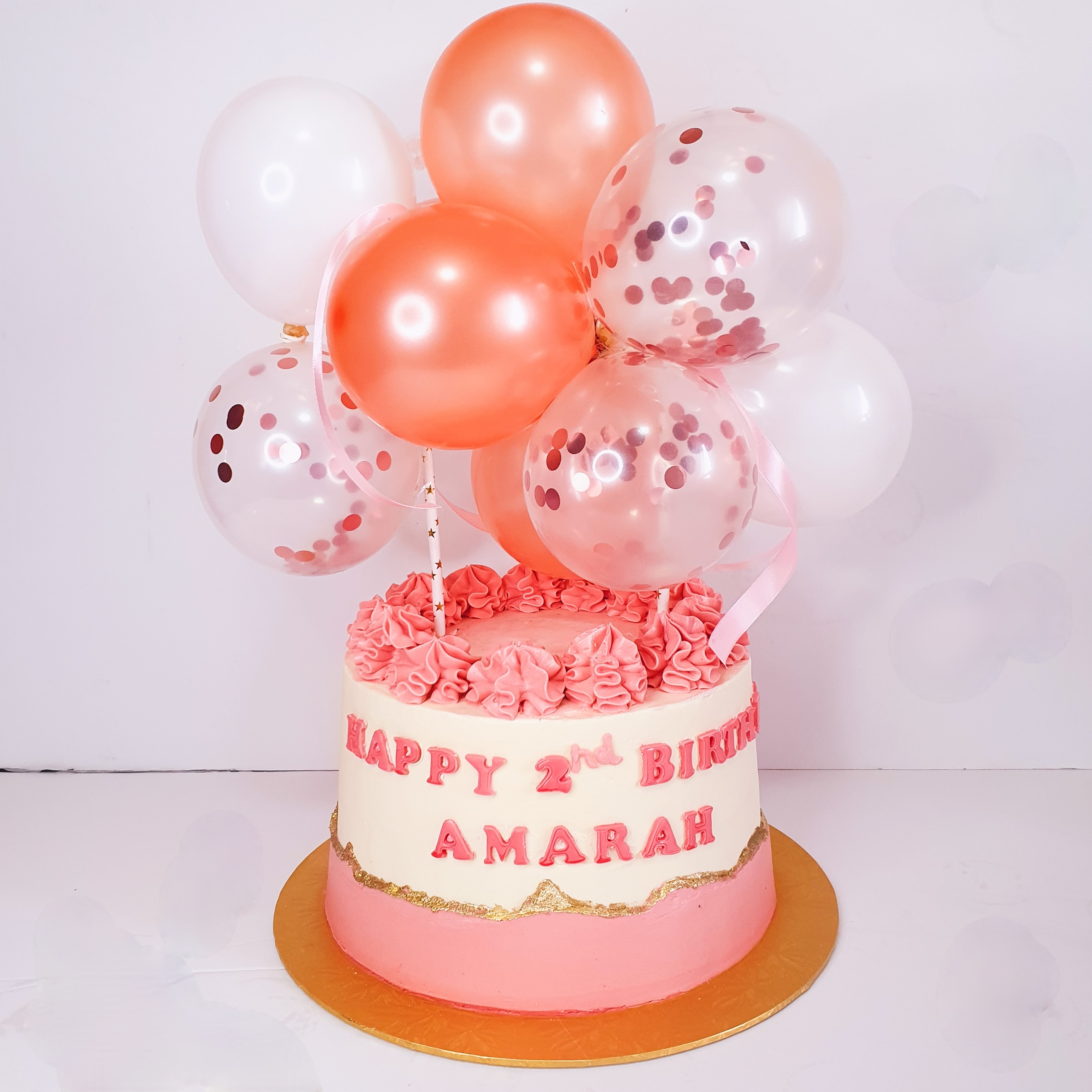 Fault line cake with balloons topper 